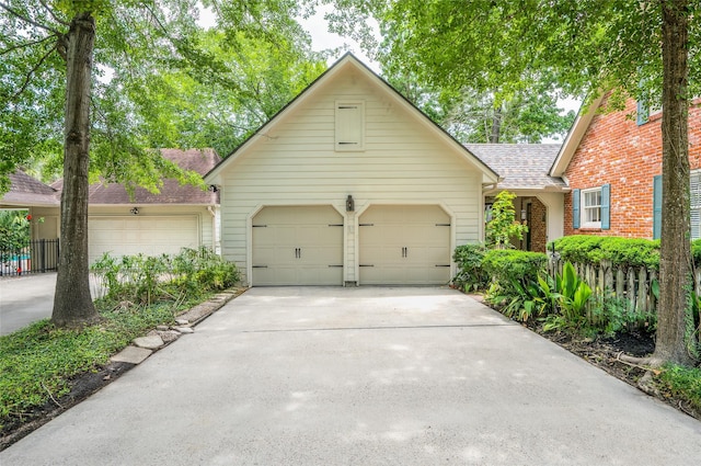 738 Stone Mountain Dr, Conroe, TX 77302 - view of front of home with driveway, an attached garage, and roof with shingles