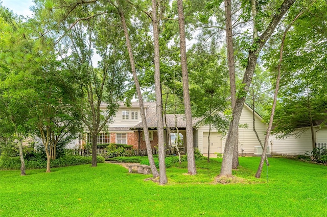 738 Stone Mountain Dr, Conroe, TX 77302 - view of front of property with a front lawn and brick siding