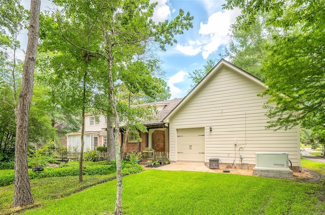 738 Stone Mountain Dr, Conroe, TX 77302 - rear view of property with a lawn and an attached garage