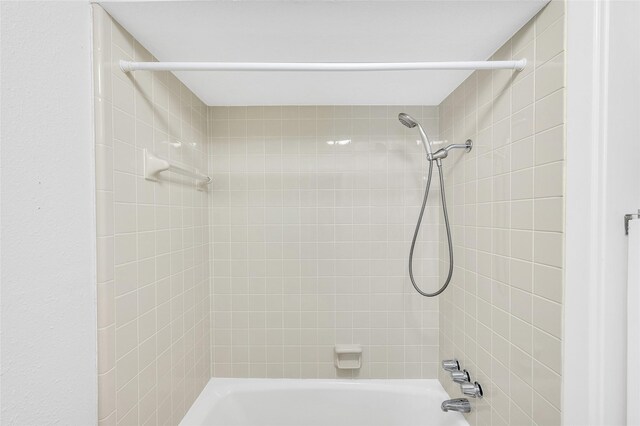 738 Stone Mountain Dr, Conroe, TX 77302 - bathroom featuring bathing tub / shower combination