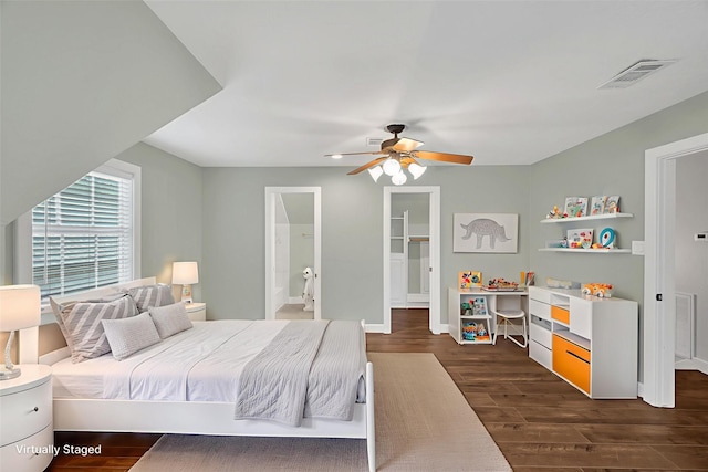 738 Stone Mountain Dr, Conroe, TX 77302 - bedroom with dark wood-type flooring, ceiling fan, and connected bathroom