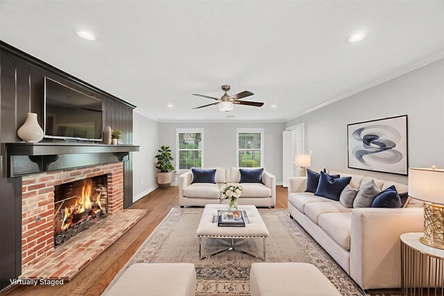 738 Stone Mountain Dr, Conroe, TX 77302 - living room featuring crown molding, ceiling fan, light wood-style floors, recessed lighting, and a fireplace