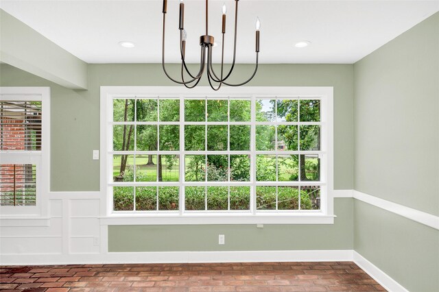 738 Stone Mountain Dr, Conroe, TX 77302 - unfurnished dining area featuring plenty of natural light, a chandelier, brick patterned floors, and recessed lighting