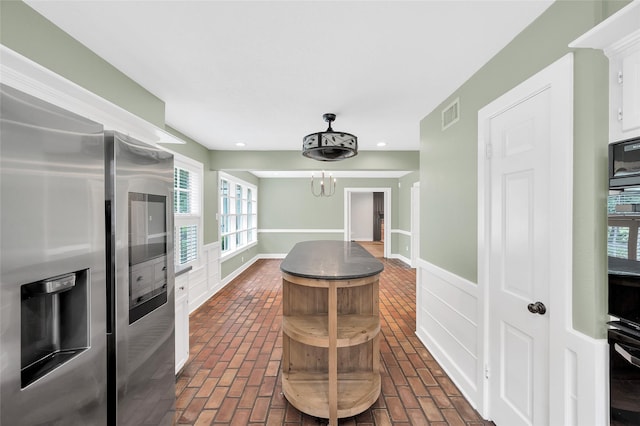 738 Stone Mountain Dr, Conroe, TX 77302 - dining area with brick flooring, recessed lighting, and a chandelier