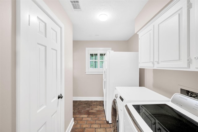 738 Stone Mountain Dr, Conroe, TX 77302 - laundry room with cabinet space and washing machine and dryer