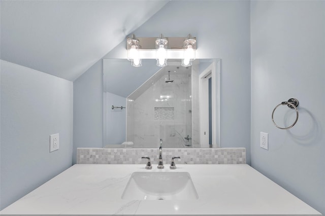 738 Stone Mountain Dr, Conroe, TX 77302 - full bathroom with lofted ceiling, a marble finish shower, vanity, and backsplash