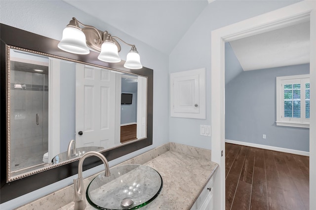 738 Stone Mountain Dr, Conroe, TX 77302 - full bathroom with lofted ceiling, a shower stall, vanity, and wood finished floors