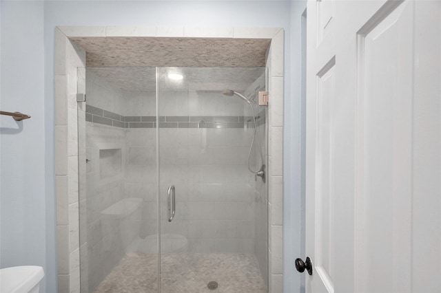 738 Stone Mountain Dr, Conroe, TX 77302 - bathroom featuring toilet and a stall shower