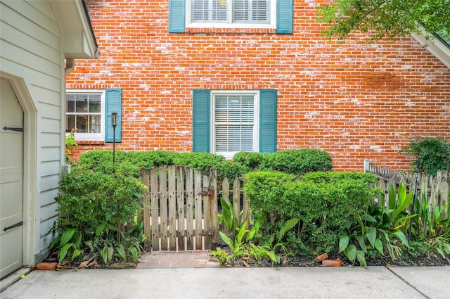 738 Stone Mountain Dr, Conroe, TX 77302 - view of exterior entry featuring brick siding