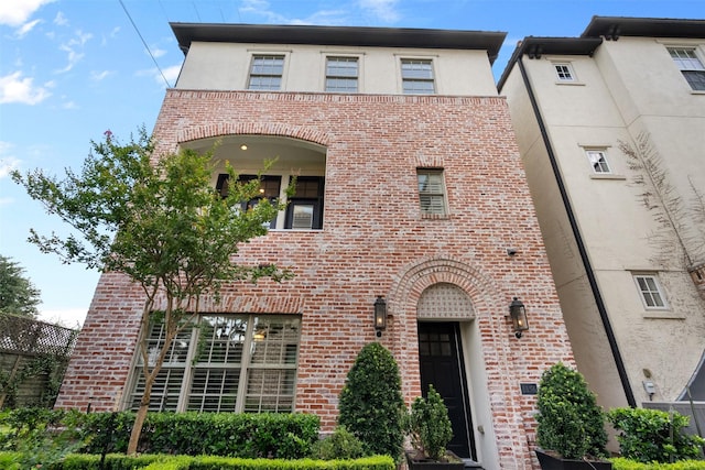 1156 Mosaico Ln, Houston, TX 77055 - view of front of property with brick siding and stucco siding