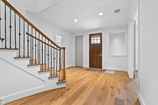 1156 Mosaico Ln, Houston, TX 77055 - foyer entrance featuring light wood-type flooring, recessed lighting, stairs, and crown molding