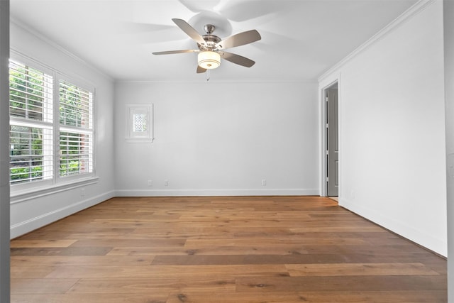 1156 Mosaico Ln, Houston, TX 77055 - spare room featuring crown molding, healthy amount of natural light, light wood finished floors, and ceiling fan