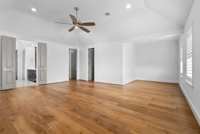 1156 Mosaico Ln, Houston, TX 77055 - empty room with vaulted ceiling, ceiling fan, light wood-style floors, and recessed lighting