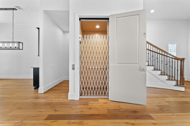 1156 Mosaico Ln, Houston, TX 77055 - interior space featuring a chandelier, recessed lighting, stairway, light wood-style flooring, and crown molding