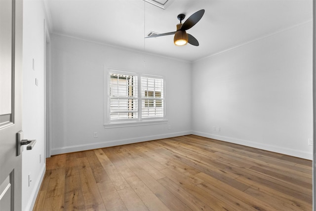 1156 Mosaico Ln, Houston, TX 77055 - unfurnished room with crown molding, hardwood / wood-style floors, attic access, and a ceiling fan