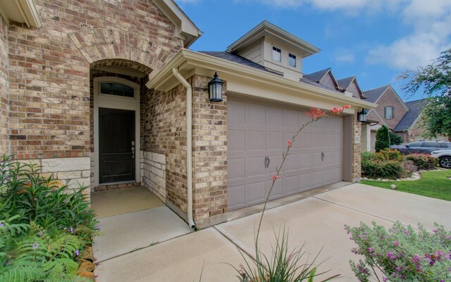 6914 N Elmwood Trl, Katy, TX 77493 - doorway to property with brick siding