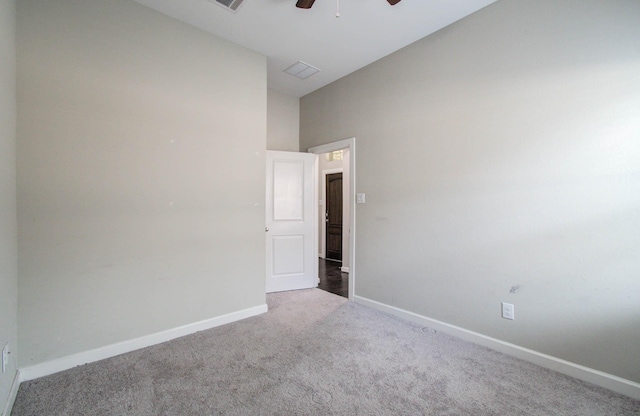 6914 N Elmwood Trl, Katy, TX 77493 - empty room featuring carpet floors, a ceiling fan, and lofted ceiling