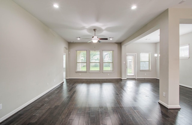6914 N Elmwood Trl, Katy, TX 77493 - unfurnished living room with ceiling fan, healthy amount of natural light, dark wood-style floors, and recessed lighting
