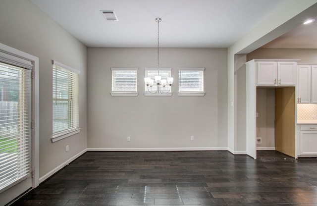 6914 N Elmwood Trl, Katy, TX 77493 - unfurnished dining area featuring dark wood-type flooring and a chandelier