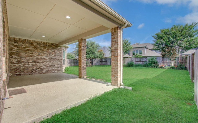 6914 N Elmwood Trl, Katy, TX 77493 - fenced backyard with a patio area