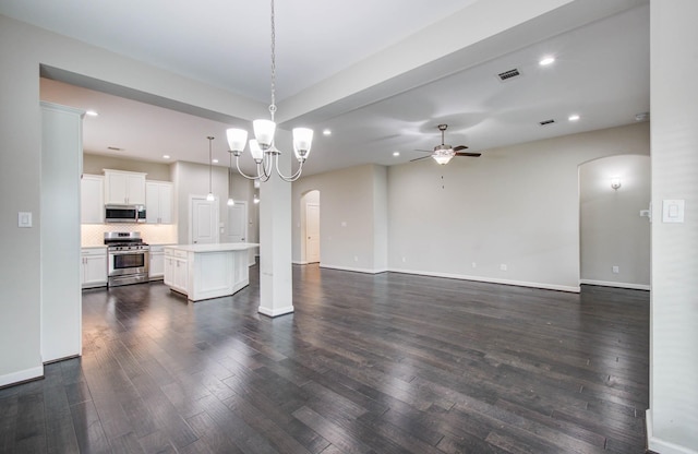 6914 N Elmwood Trl, Katy, TX 77493 - unfurnished living room with arched walkways, a ceiling fan, dark wood-style floors, and recessed lighting