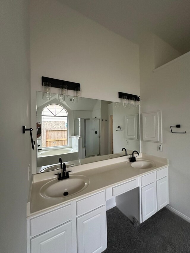 2606 Iris Ct, Pearland, TX 77584 - bathroom featuring a shower stall and double vanity