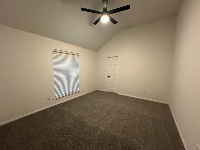 2606 Iris Ct, Pearland, TX 77584 - empty room with a ceiling fan, vaulted ceiling, and dark colored carpet