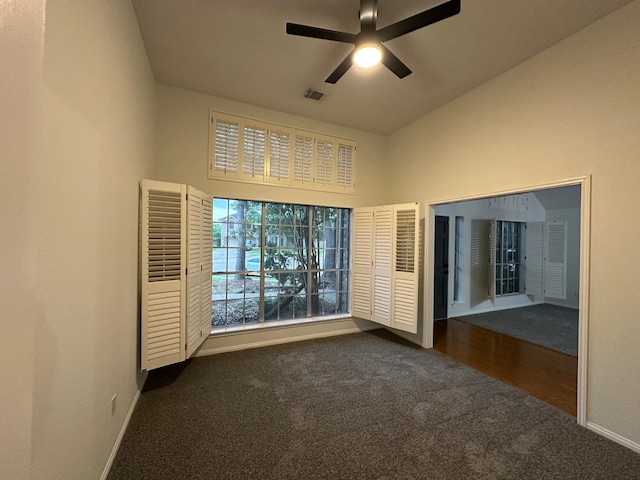 2606 Iris Ct, Pearland, TX 77584 - spare room with dark carpet, a high ceiling, and ceiling fan