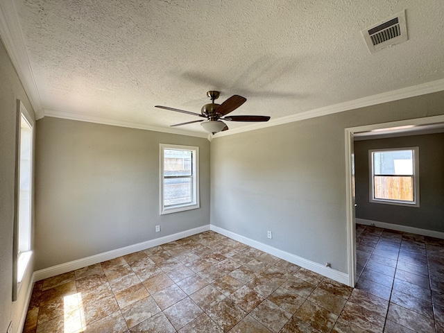 1013 E 40th St, Houston, TX 77022 - spare room with healthy amount of natural light, crown molding, ceiling fan, and a textured ceiling