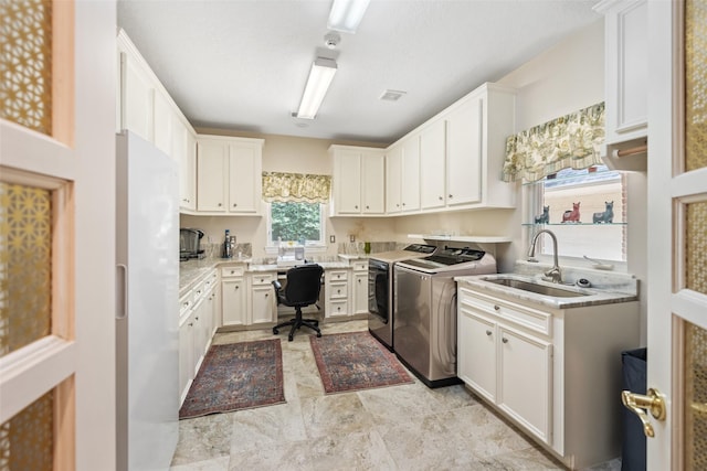 7417 Teaswood Dr, Conroe, TX 77304 - laundry room with a sink and washer and dryer