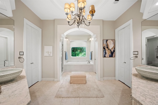 7417 Teaswood Dr, Conroe, TX 77304 - bathroom with a garden tub, vanity, and a closet
