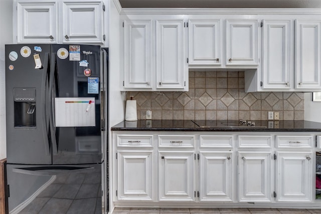 8710 Candleshine Cir, Houston, TX 77095 - kitchen featuring black appliances, white cabinets, decorative backsplash, and dark stone countertops