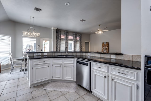 8710 Candleshine Cir, Houston, TX 77095 - kitchen with dishwasher, ceiling fan, white cabinetry, light tile patterned flooring, and vaulted ceiling