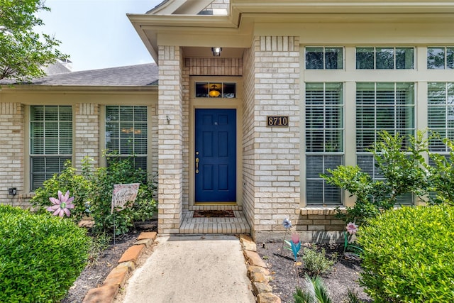 8710 Candleshine Cir, Houston, TX 77095 - property entrance featuring brick siding and roof with shingles