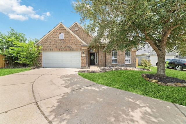 23703 Shaw Perry Ln, Katy, TX 77493 - traditional-style home featuring concrete driveway, brick siding, a front lawn, and an attached garage