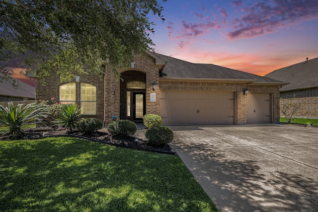 907 Fairway Dr, La Porte, TX 77571 - view of front of house with brick siding, a garage, driveway, a front yard, and a shingled roof