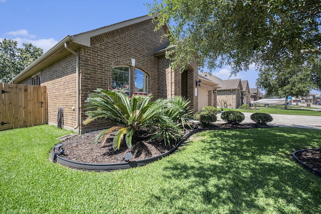 907 Fairway Dr, La Porte, TX 77571 - view of side of home featuring brick siding and a garage