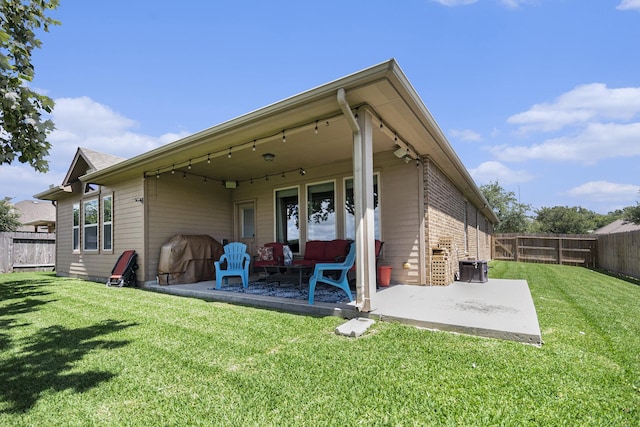 907 Fairway Dr, La Porte, TX 77571 - rear view of house featuring a patio, a fenced backyard, and brick siding