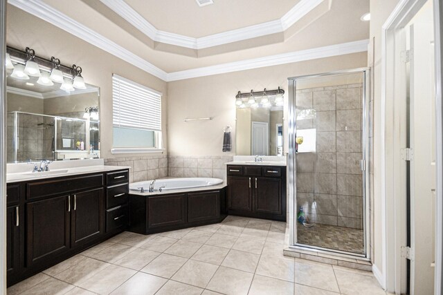 907 Fairway Dr, La Porte, TX 77571 - bathroom with a stall shower, two vanities, a bath, tile patterned floors, and crown molding