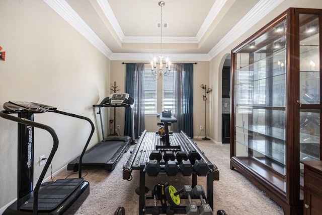 907 Fairway Dr, La Porte, TX 77571 - workout room featuring carpet, arched walkways, crown molding, a tray ceiling, and a chandelier