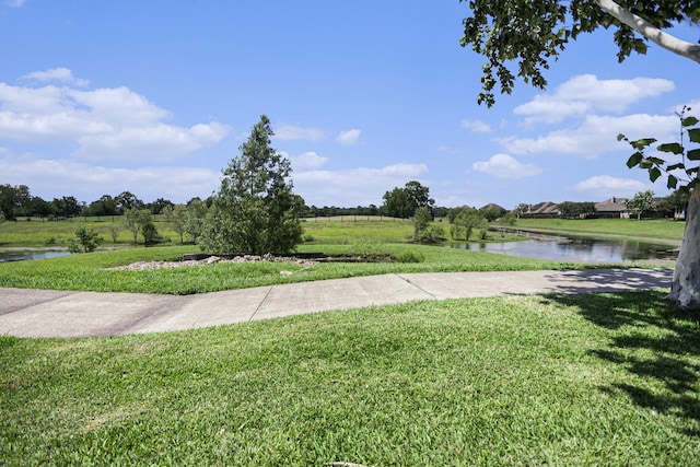 907 Fairway Dr, La Porte, TX 77571 - view of green lawn with a water view