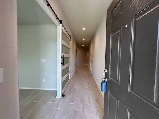4215 Stuebner Hill Dr, Houston, TX 77068 - hall with light wood-style floors, a barn door, built in features, and recessed lighting