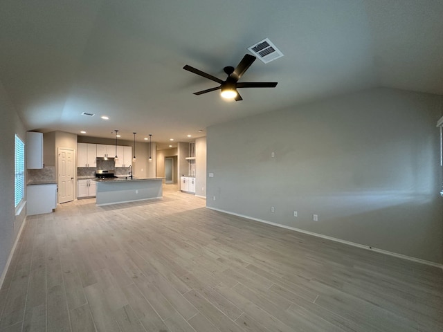 4215 Stuebner Hill Dr, Houston, TX 77068 - unfurnished living room with light wood-style flooring, a ceiling fan, and recessed lighting