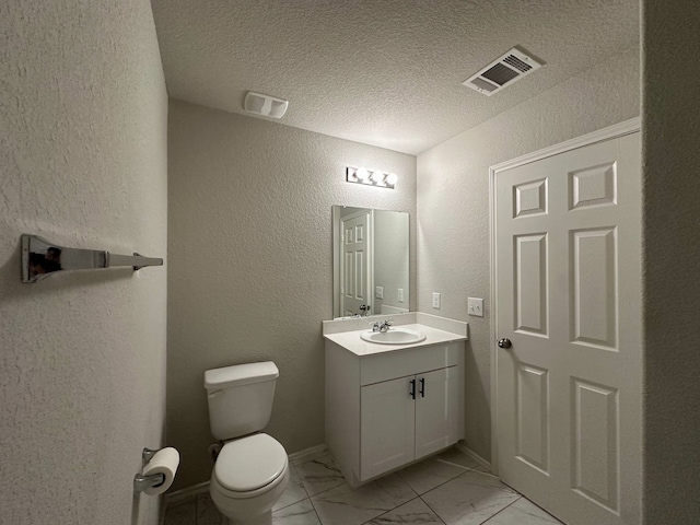 4215 Stuebner Hill Dr, Houston, TX 77068 - half bathroom with a textured wall, vanity, marble look tile flooring, and a textured ceiling
