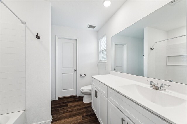 10122 Clearwick St, Houston, TX 77034 - bathroom with vanity, wood finished floors, and bathtub / shower combination