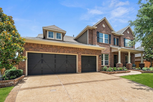 19522 Hope Springs Ln, Cypress, TX 77433 - view of front facade featuring brick siding, an attached garage, driveway, and a porch