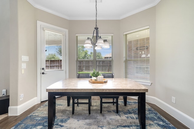19522 Hope Springs Ln, Cypress, TX 77433 - dining area featuring a chandelier, dark wood-style flooring, and ornamental molding