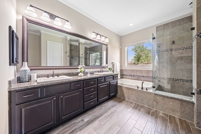 19522 Hope Springs Ln, Cypress, TX 77433 - bathroom with double vanity, tiled shower, a garden tub, ornamental molding, and recessed lighting