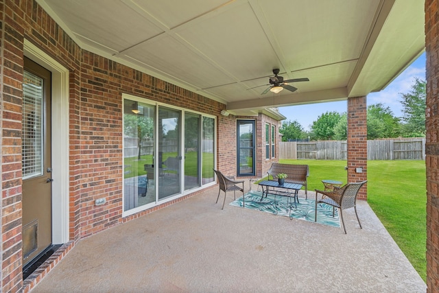 19522 Hope Springs Ln, Cypress, TX 77433 - fenced backyard with ceiling fan, a patio, and outdoor lounge area