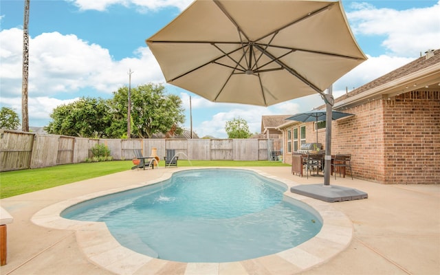 115 Meadow Ridge Way, Clute, TX 77531 - view of swimming pool with a fenced backyard, a patio area, and outdoor dining space